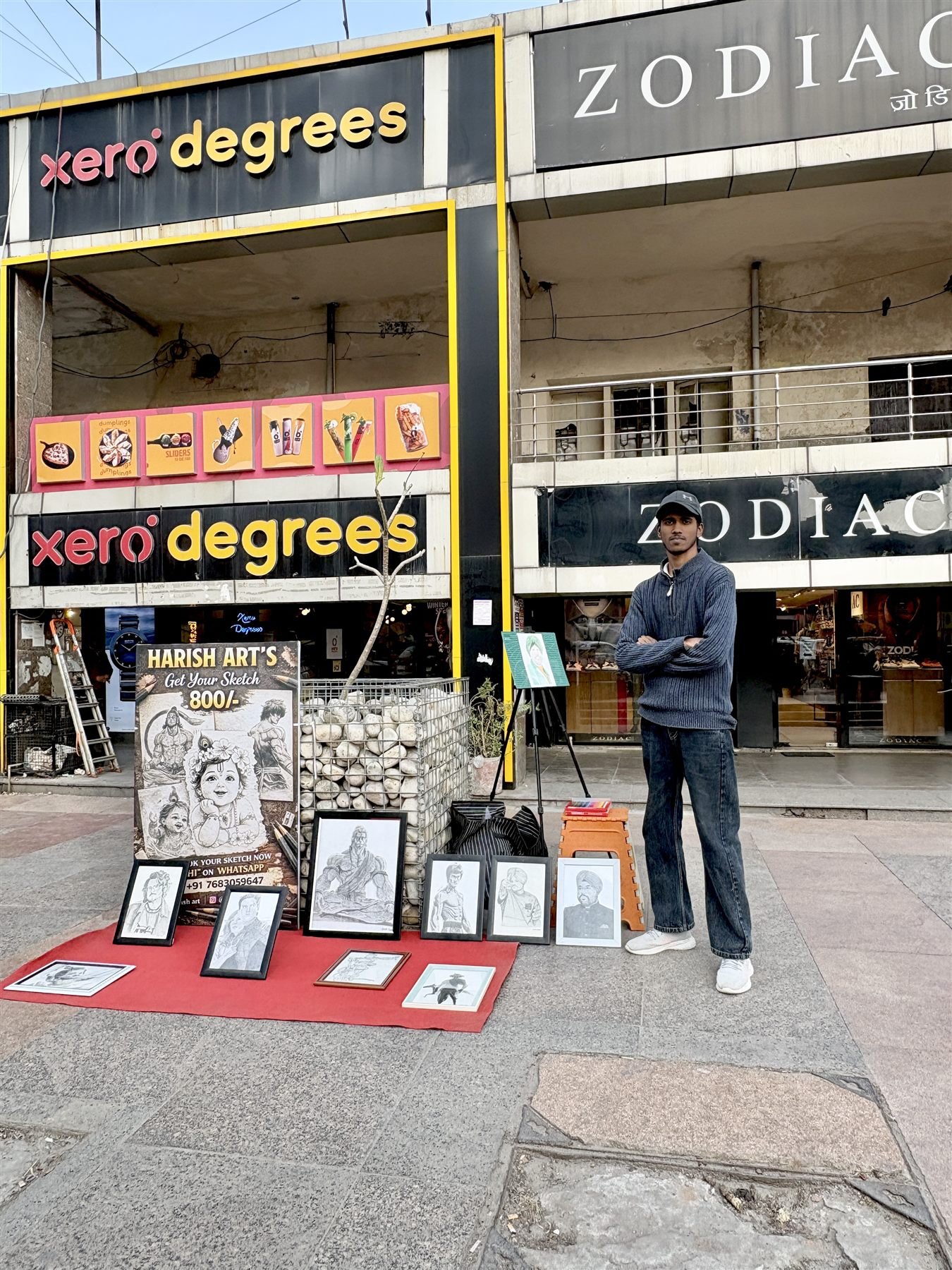 Harish Rawat beside his artwork display in Noida